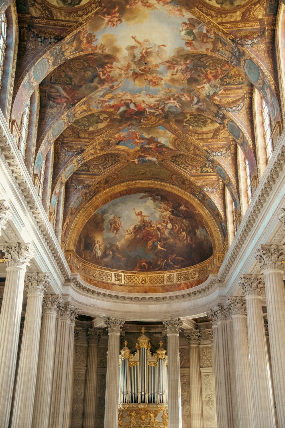 the ceiling of a building with a painting on it