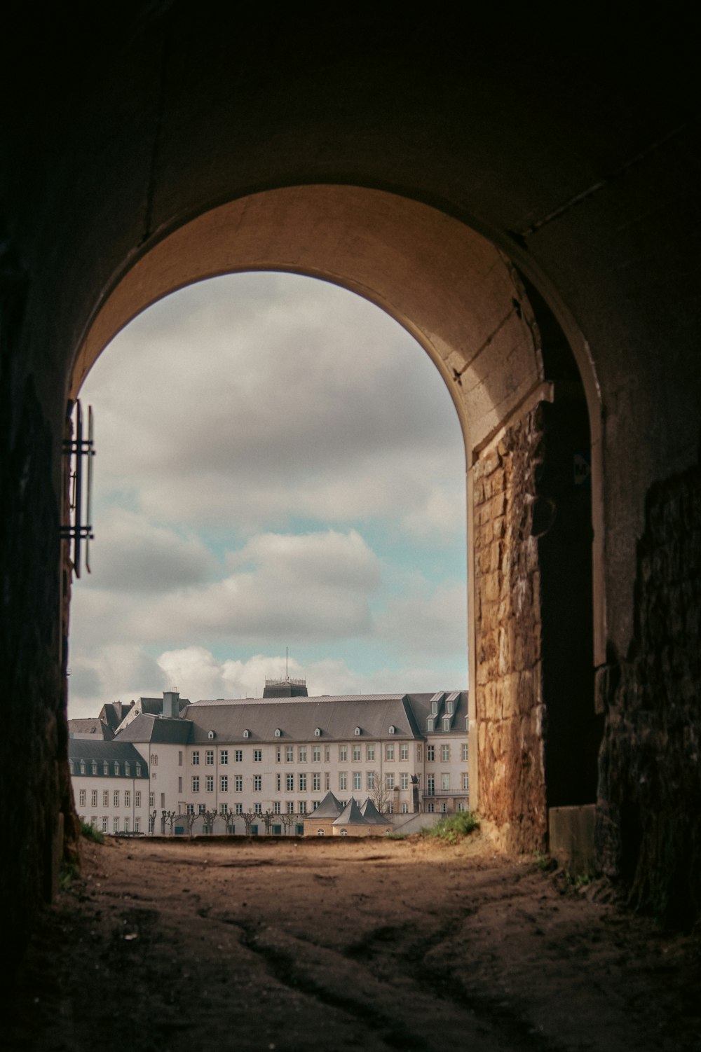 a view of a building through a tunnel