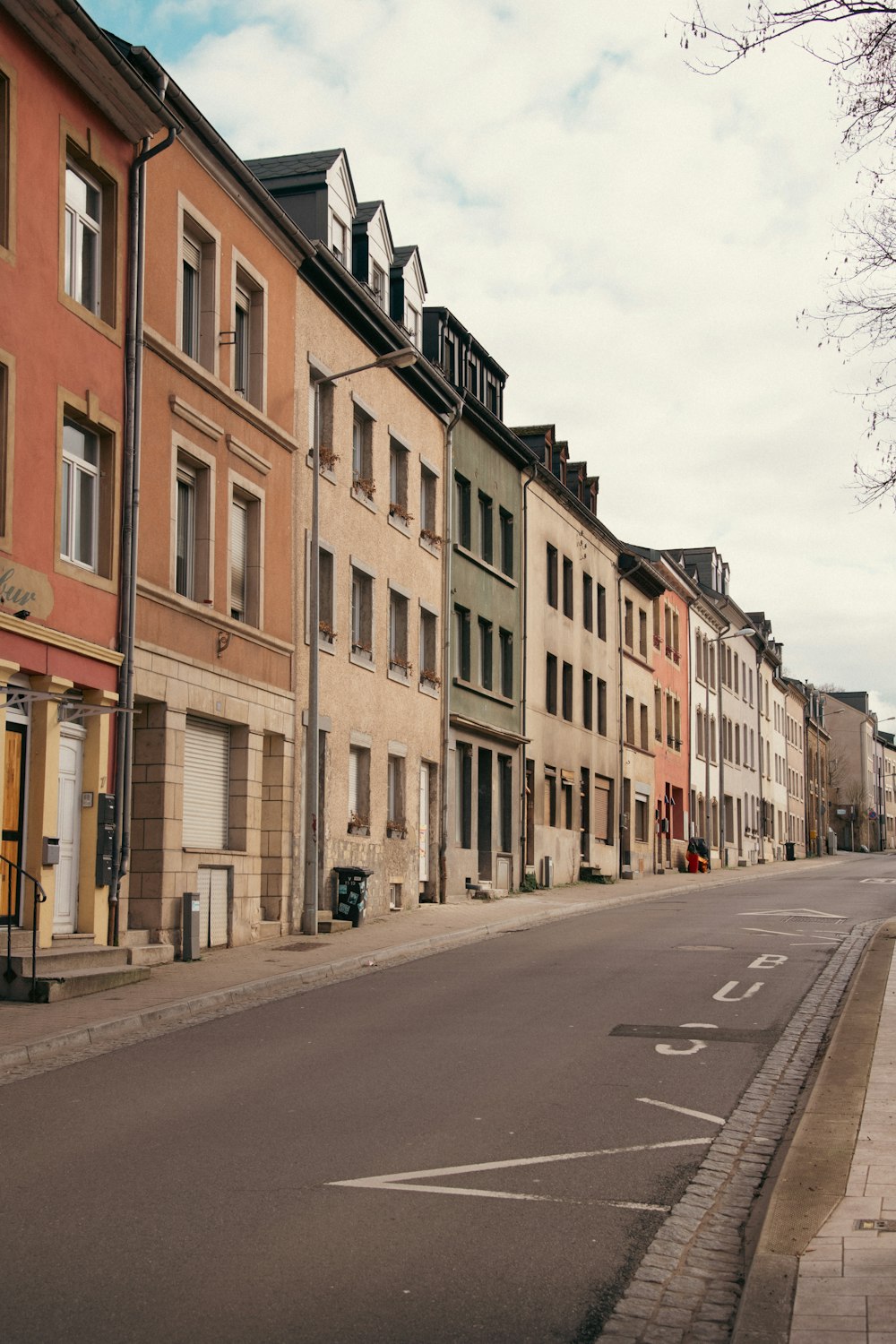 a row of buildings line a street in a city