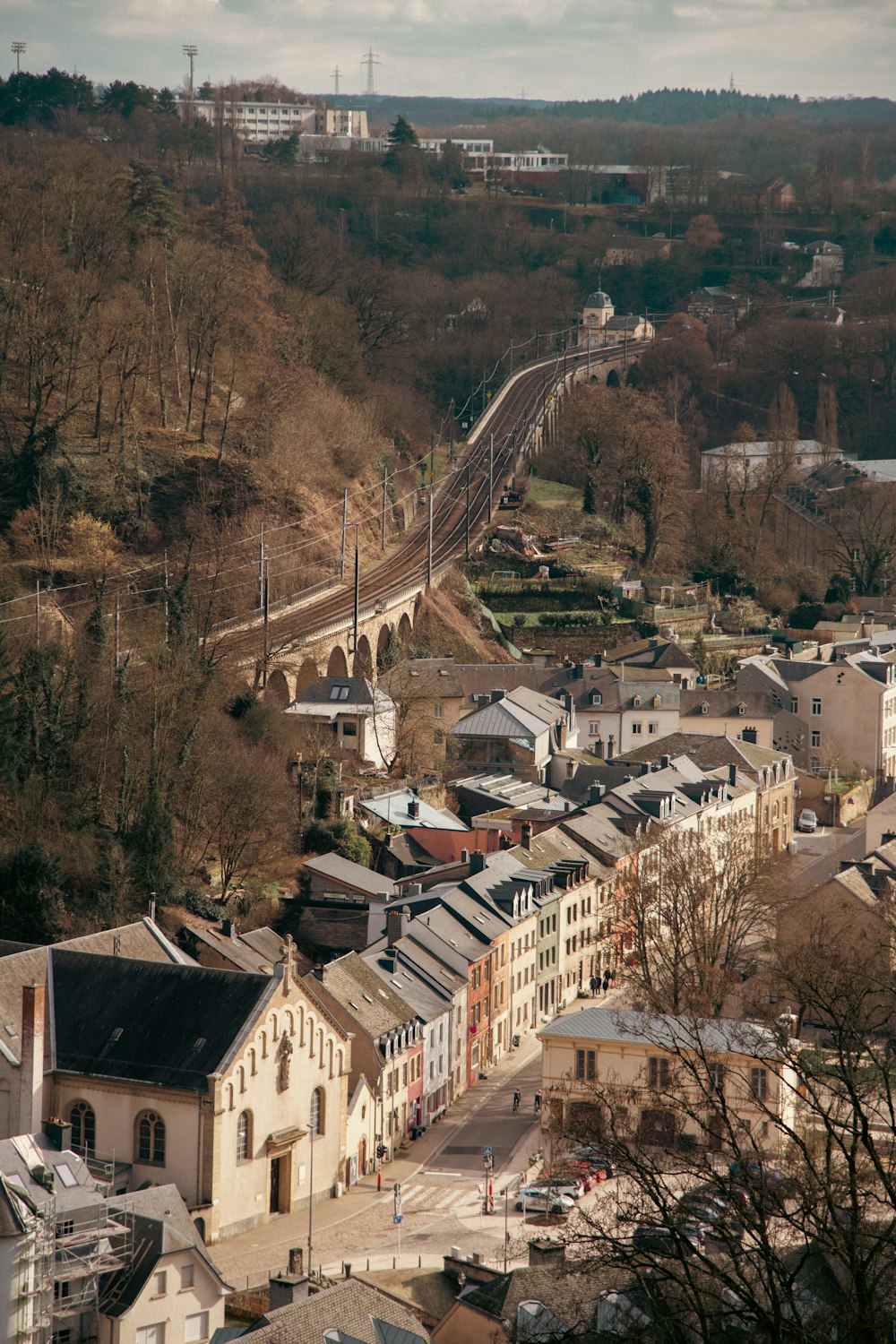 a view of a city with a train on the tracks