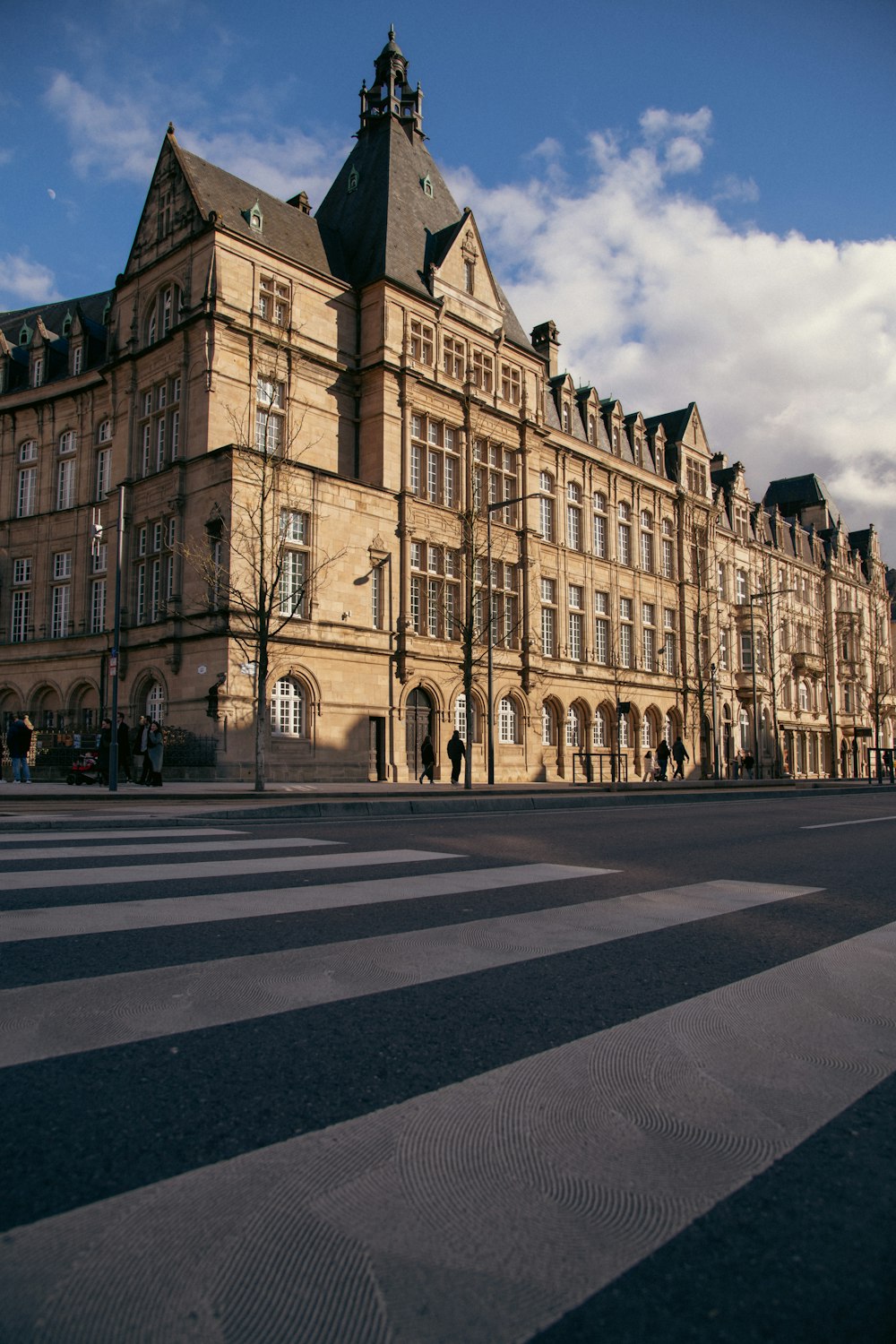 a large building sitting on the side of a road