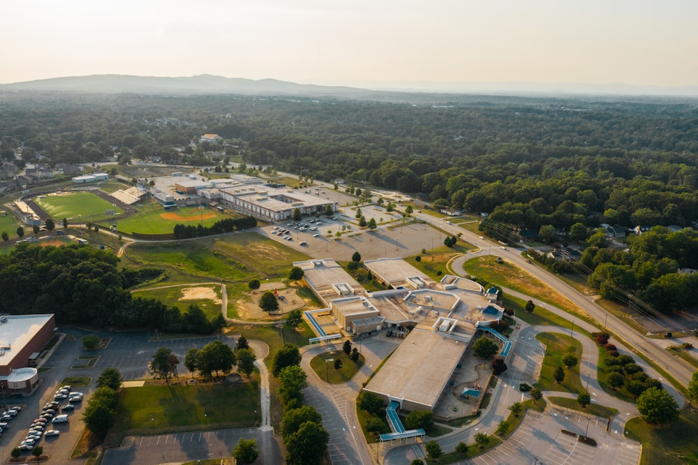 an aerial view of a school and parking lot