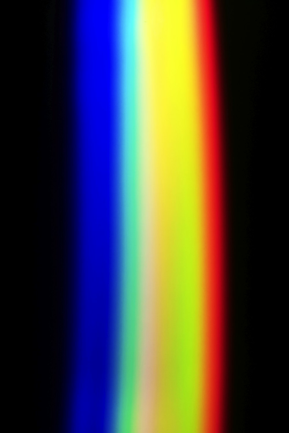 a black background with a rainbow colored line