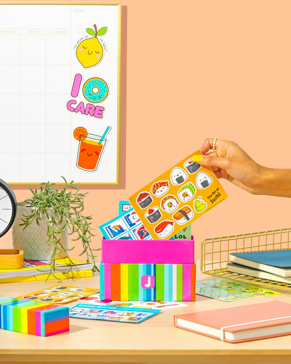 a person holding a card in front of a stack of books