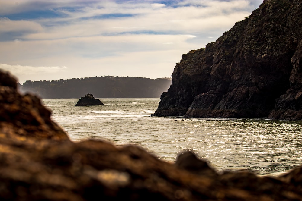 a large body of water surrounded by rocks