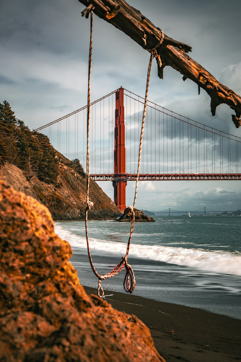 a view of the golden gate bridge from the beach