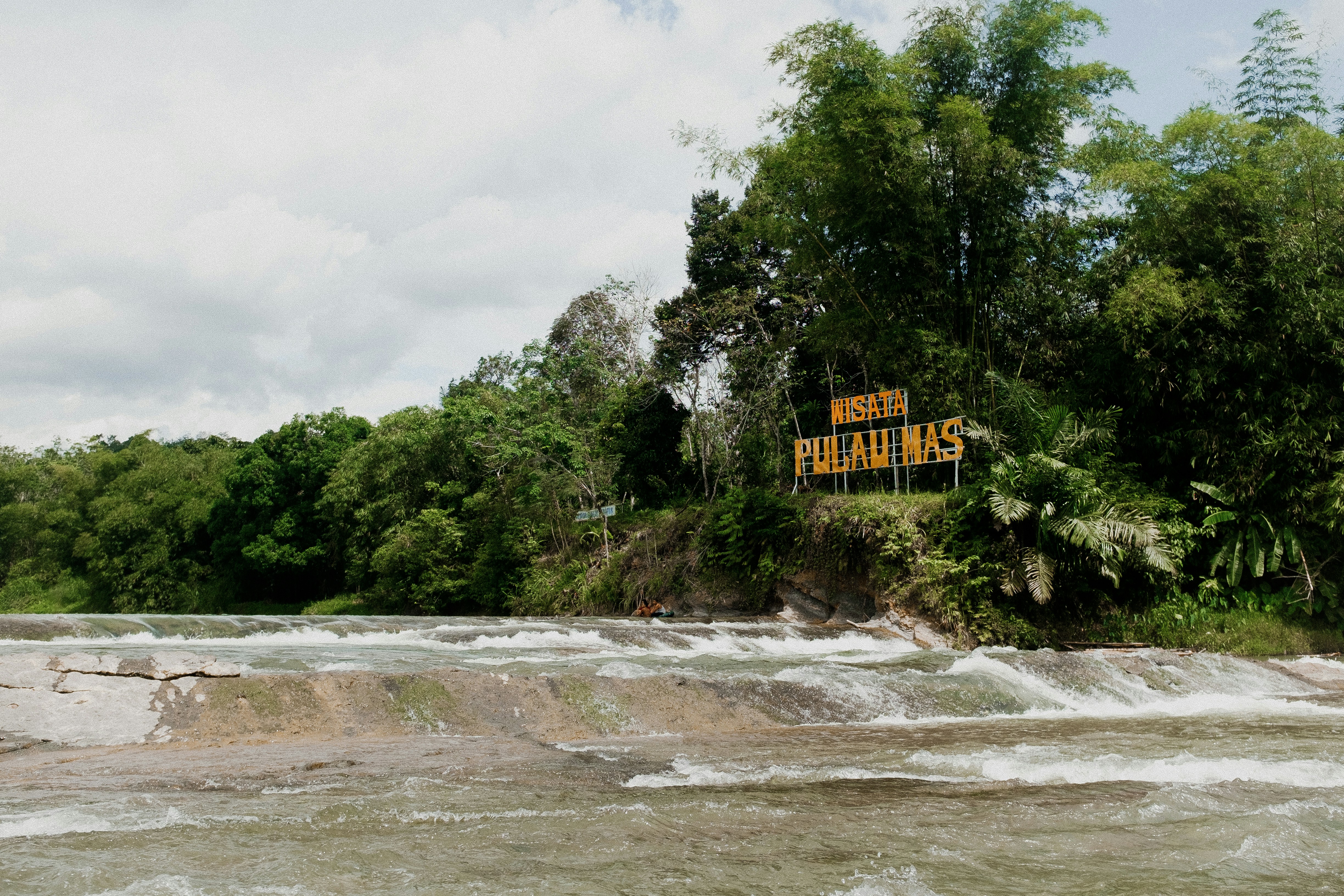 Stop image for Taos Adventure Loop: 3 Days of Family & Nature Escapes - a sign that is on the side of a river -  in Southwest USA - Photo by Lighten Up on Unsplash