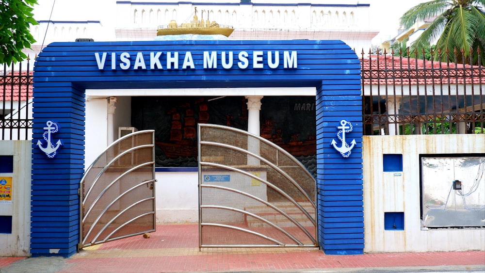 a blue and white building with an open door