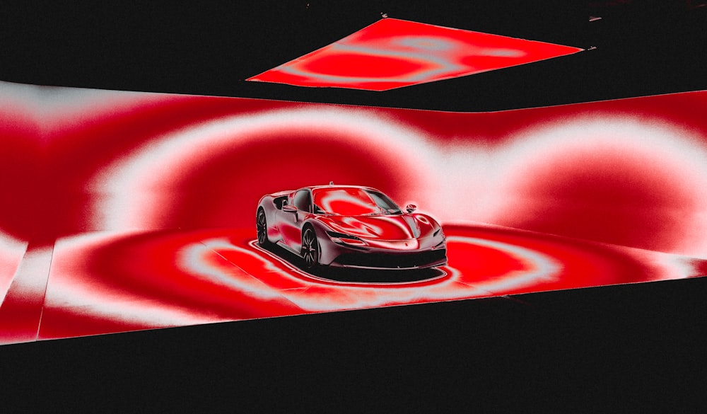 a car is shown in a red and black photo
