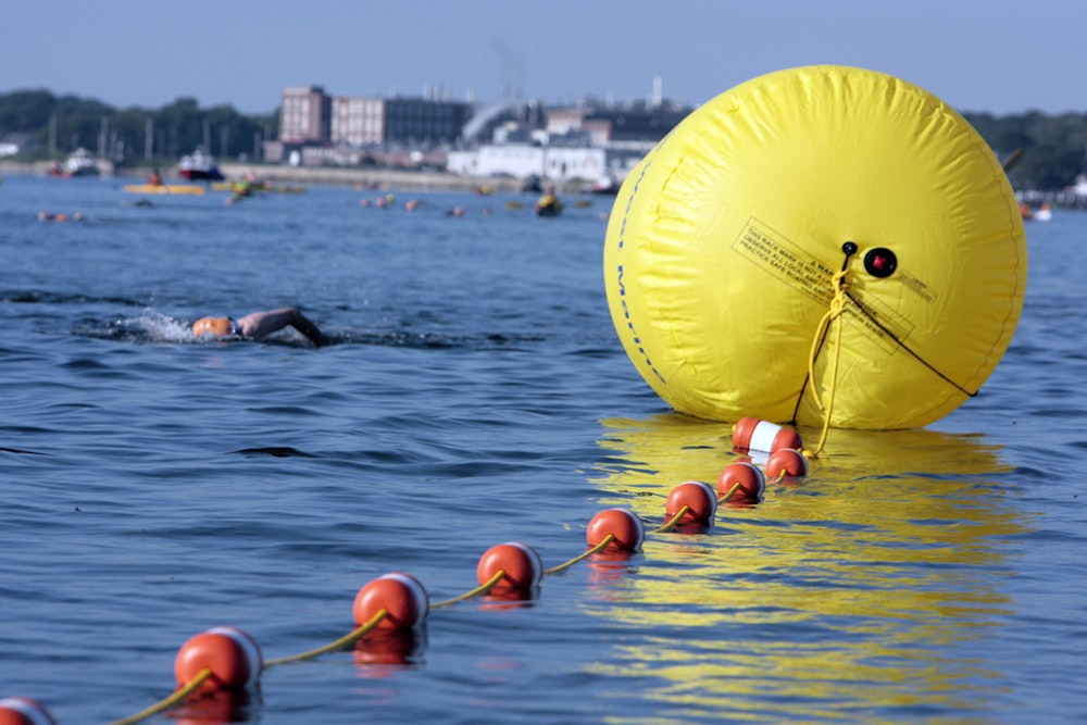 a large yellow object floating in the water