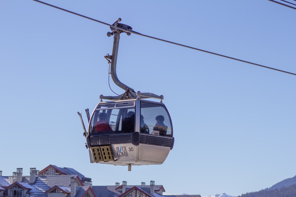 a ski lift with a person on the top of it