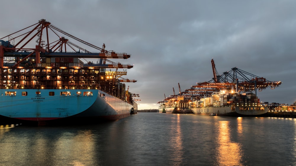 a couple of large ships sitting in a harbor