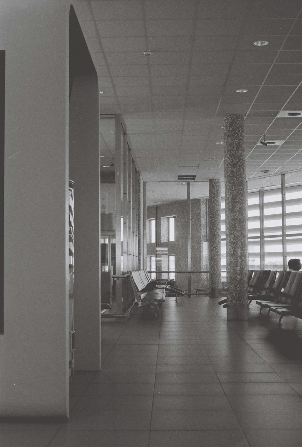 a black and white photo of a waiting area
