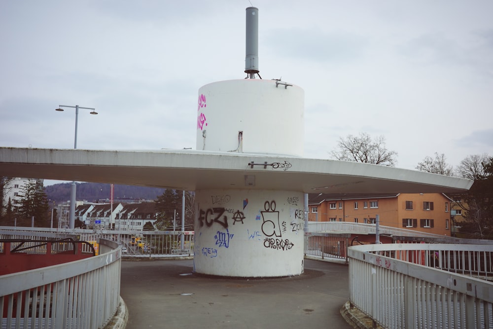 a white building with graffiti on the side of it