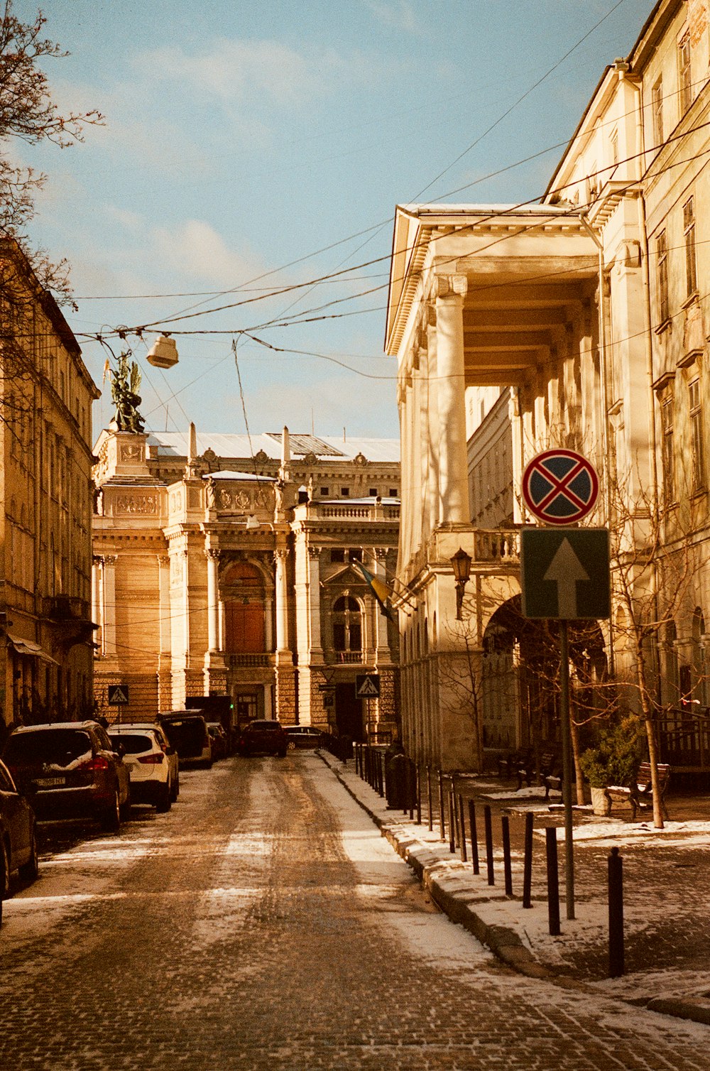 a street with cars parked on the side of it