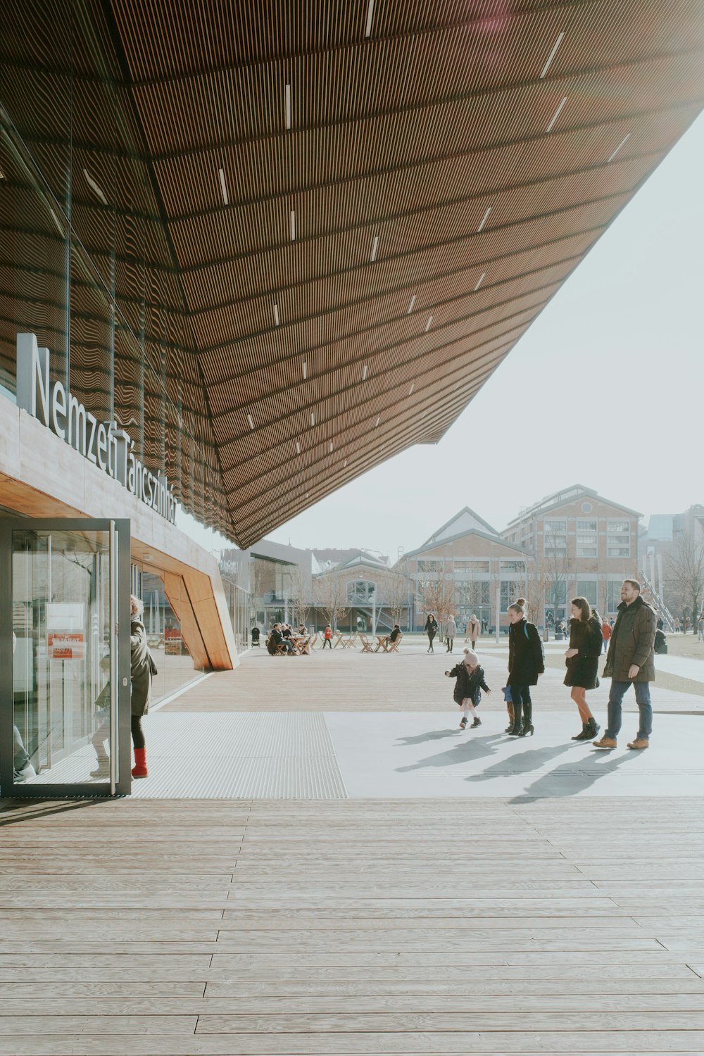 a group of people standing outside of a building