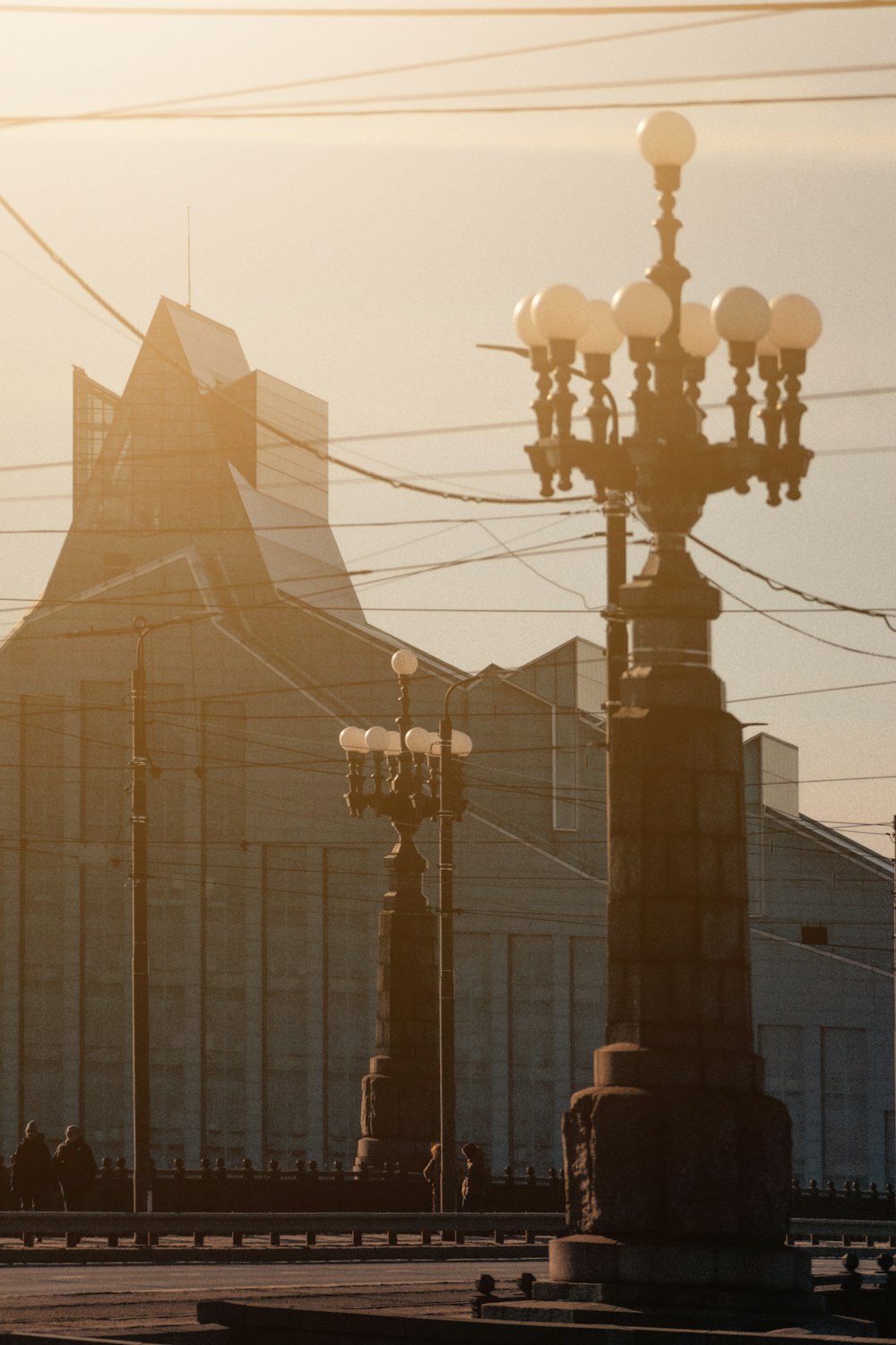 a street light with a building in the background