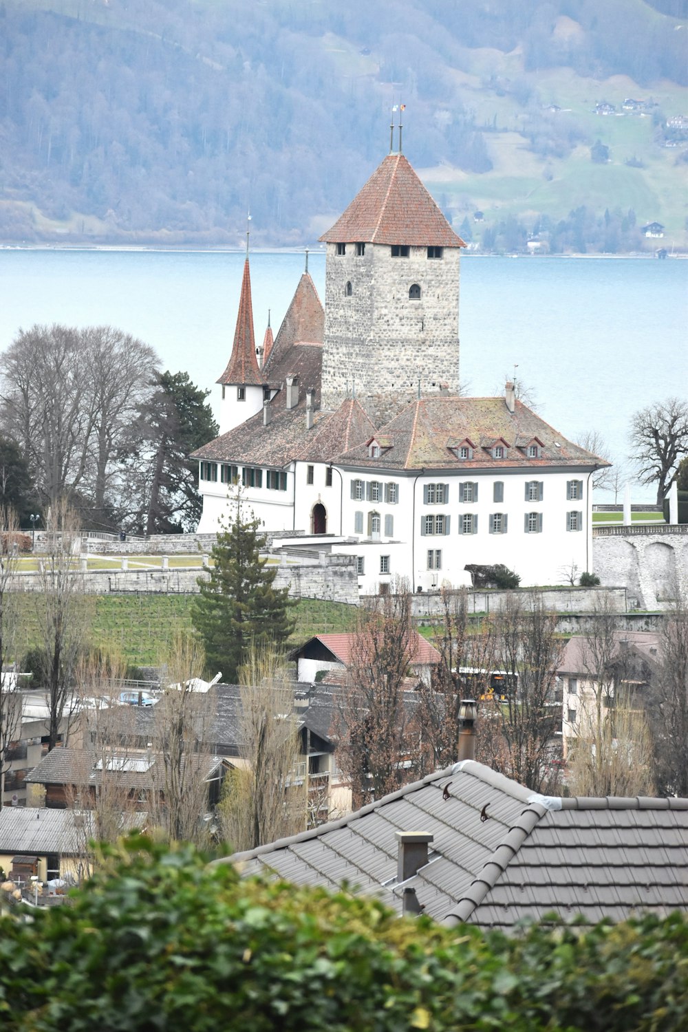 a large white building with a clock tower