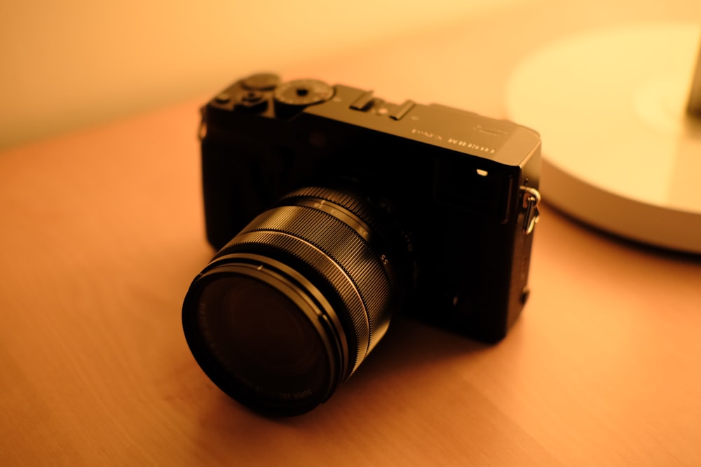 a camera sitting on top of a wooden table