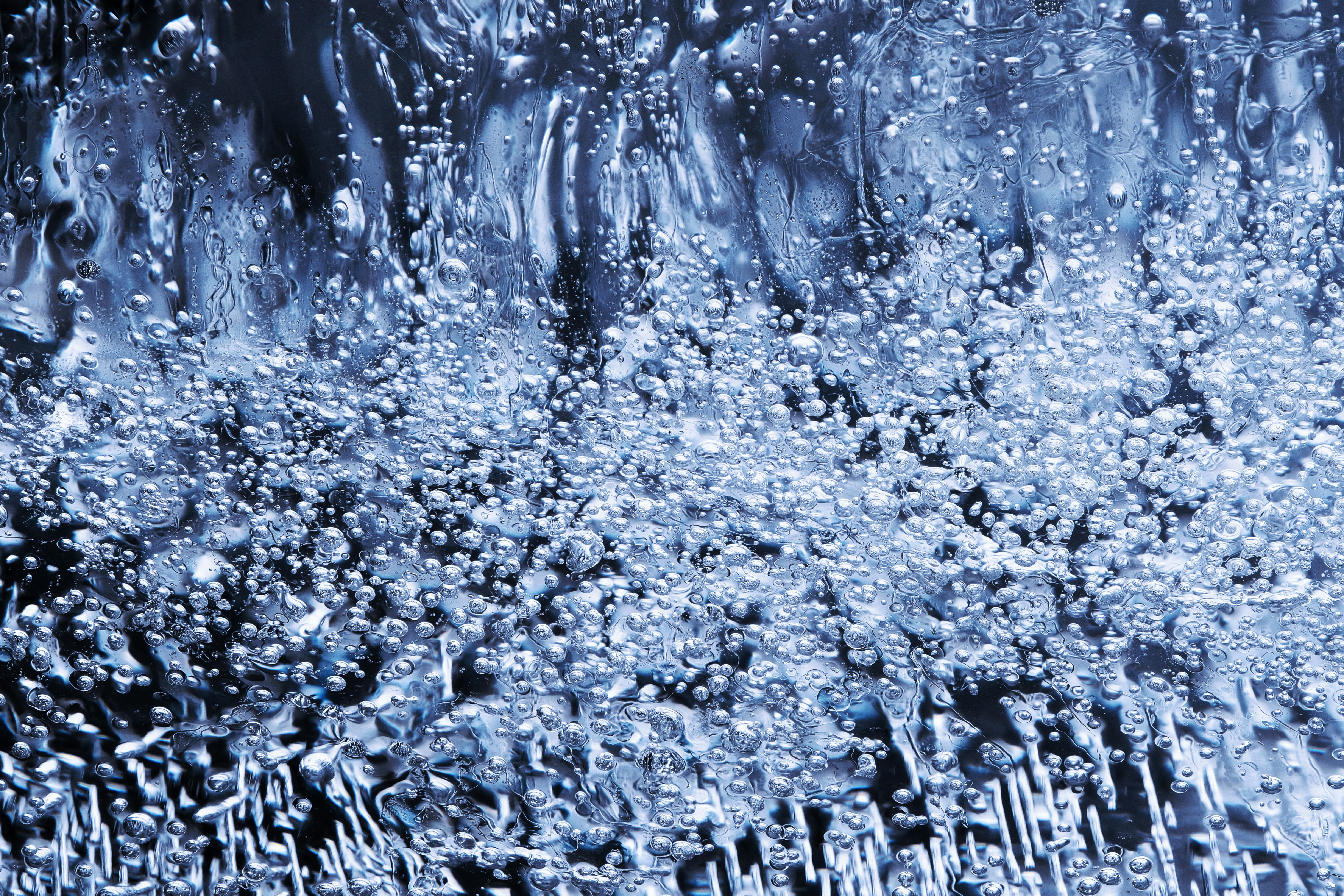 a close up of water bubbles on a surface