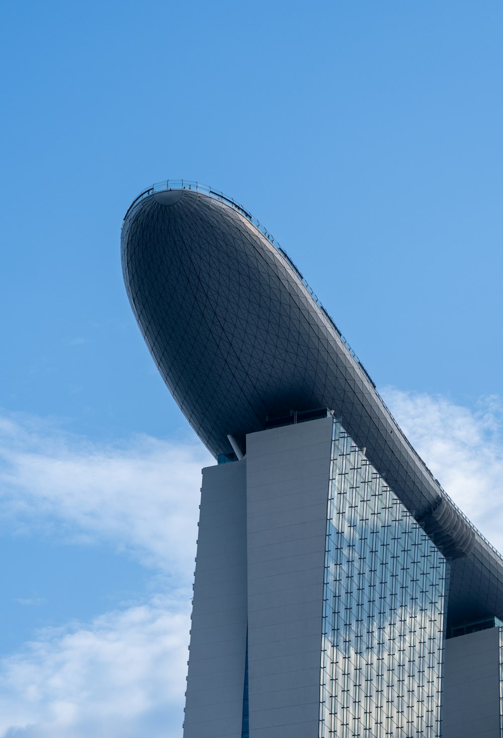 a very tall building with a curved roof