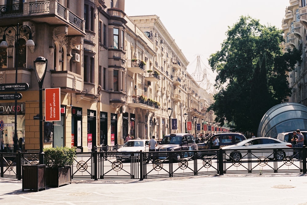 a city street filled with lots of tall buildings