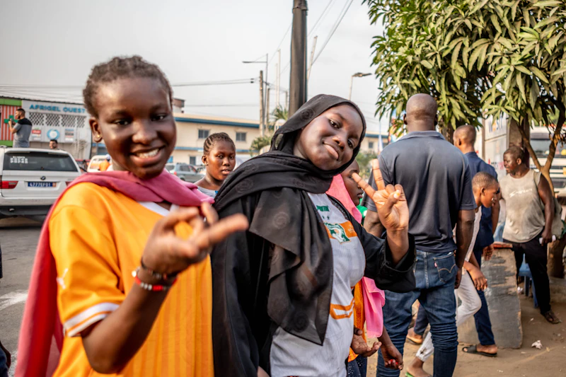 Children playing and smiling in a community we serve