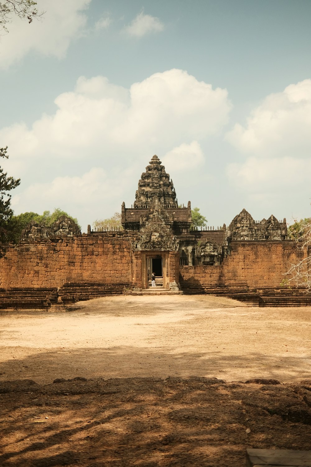 a large stone building with a sky background