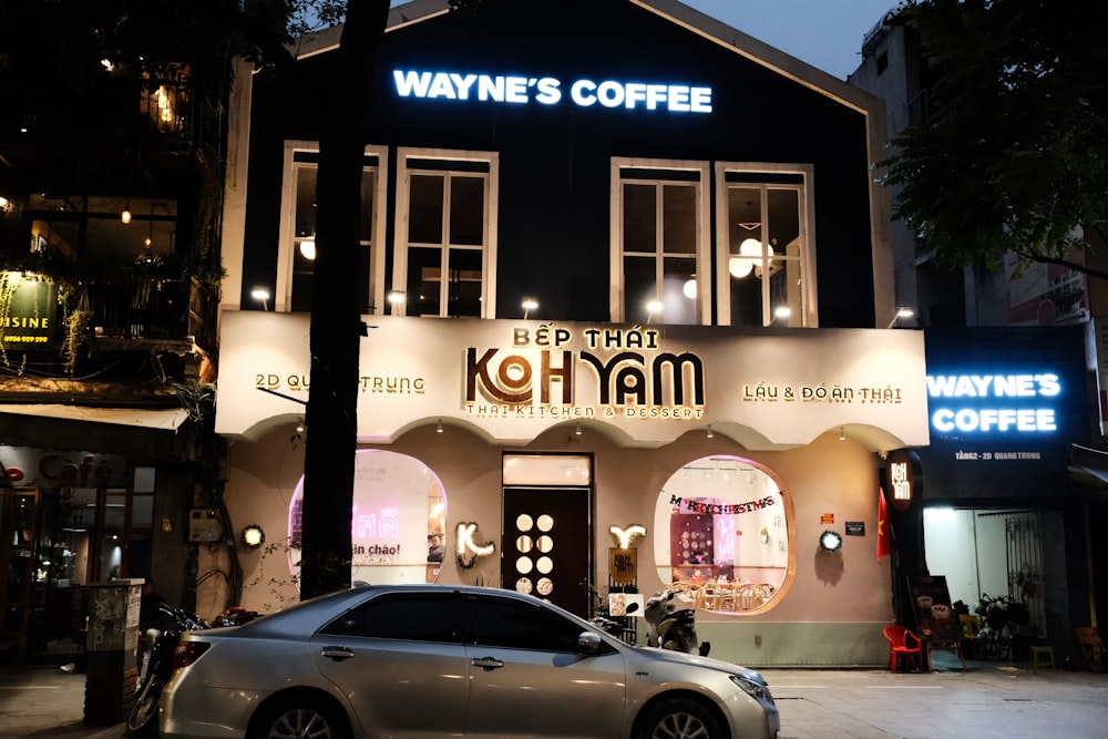 a car parked in front of a coffee shop