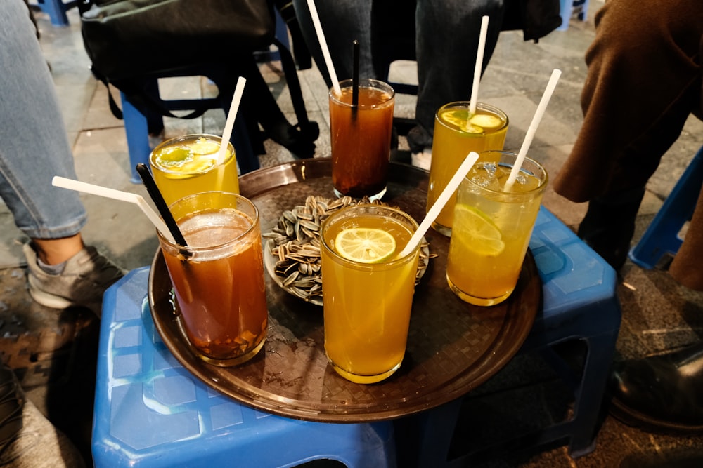 a table topped with glasses filled with drinks