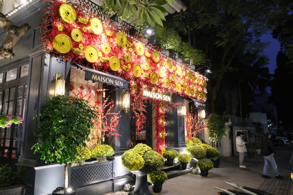 a store front decorated with yellow and red decorations
