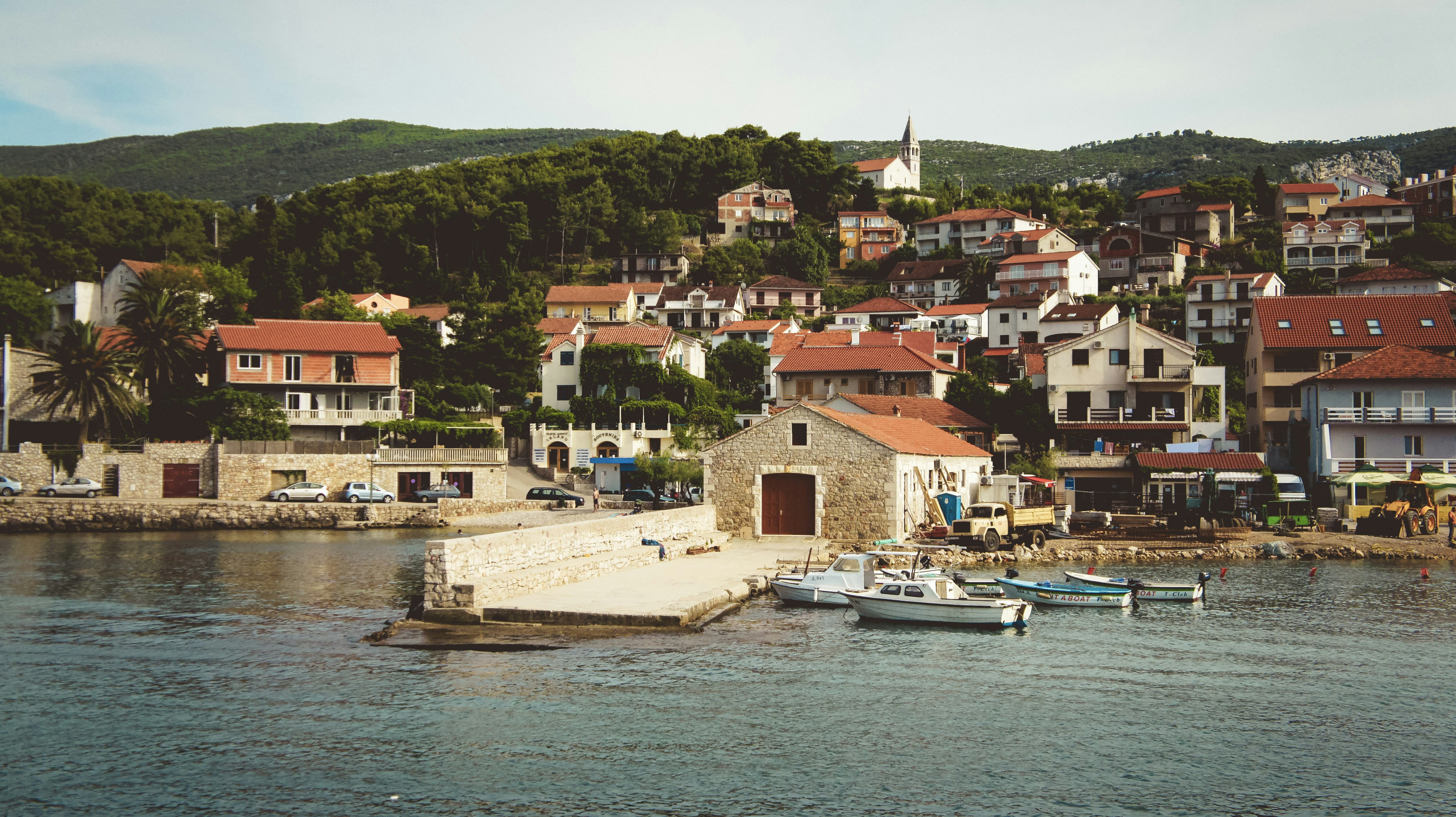 a group of boats floating on top of a body of water