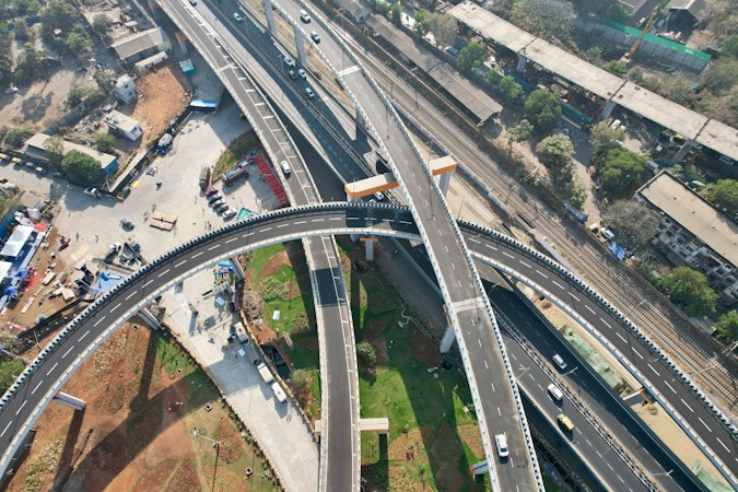 Aerial view of a multi-lane highway, representing the 215 Beltway corridor between Far Hills Avenue and Lake Mead Boulevard in northwest Las Vegas