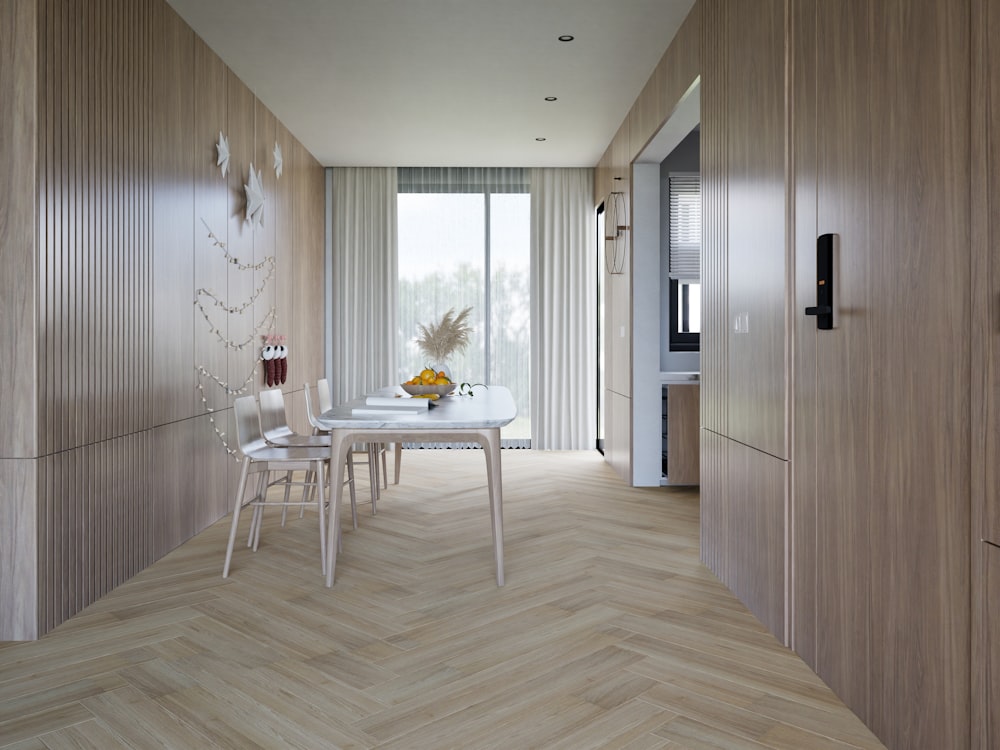 a dining room with a table and chairs