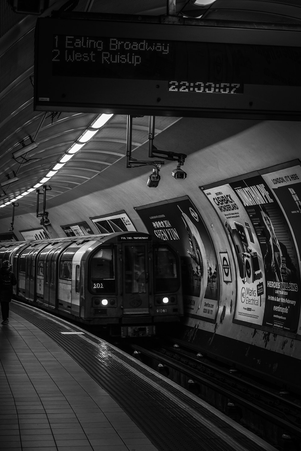 a black and white photo of a subway train