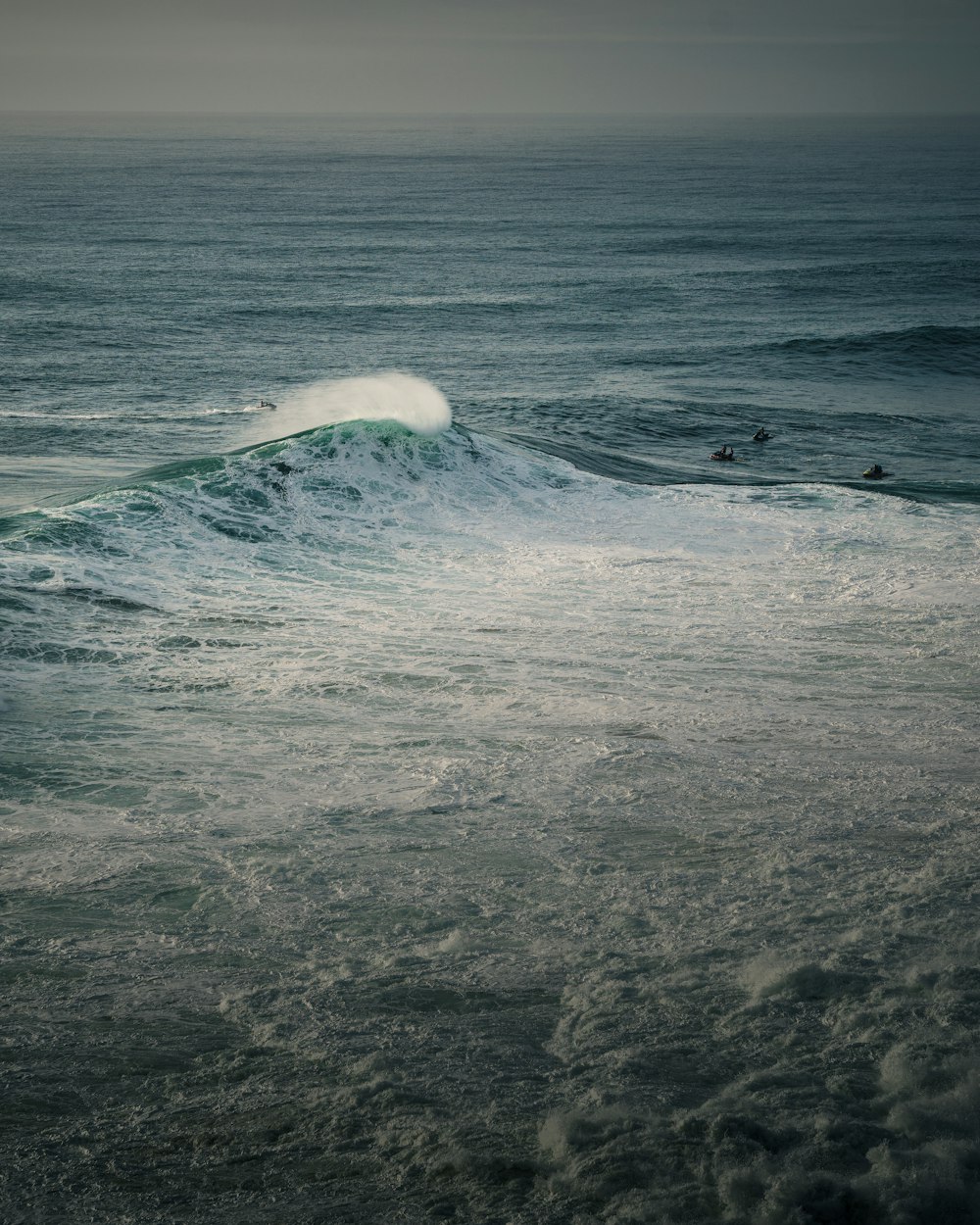 a surfer riding a wave in the ocean