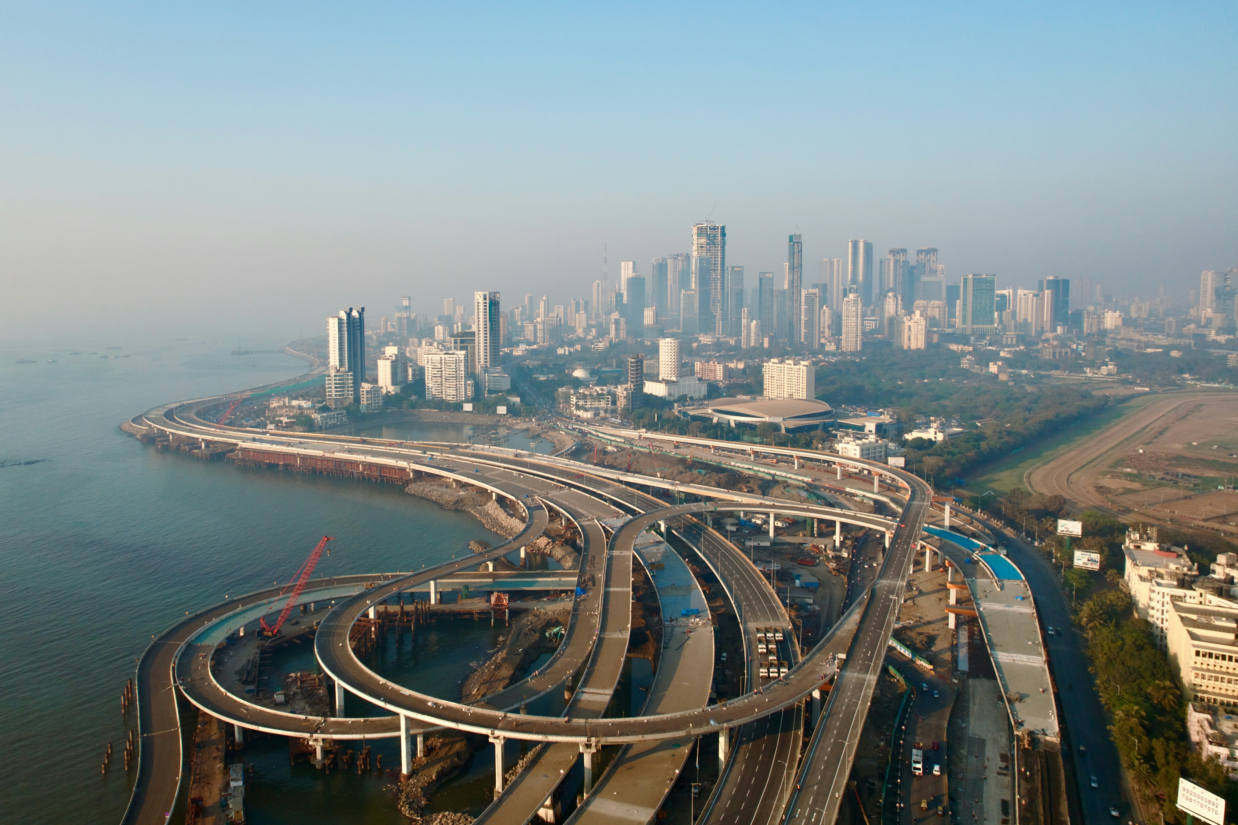 an aerial view of a highway and a city