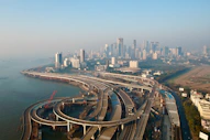 an aerial view of a highway and a city