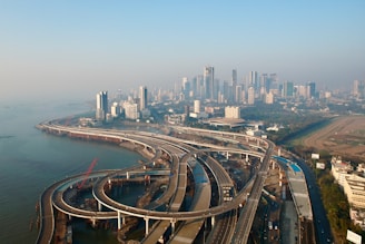 an aerial view of a highway and a city
