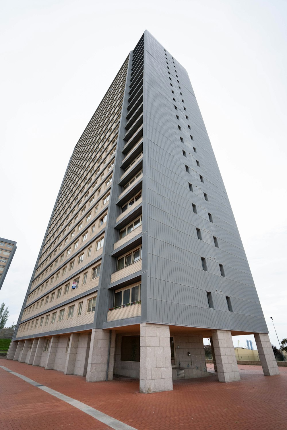 a very tall building sitting on the side of a road