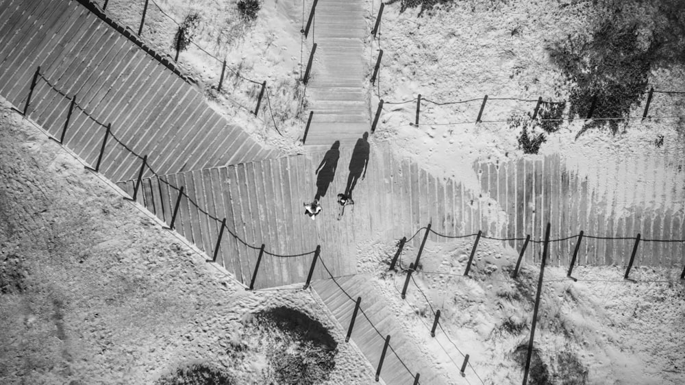 a black and white photo of a fenced in area