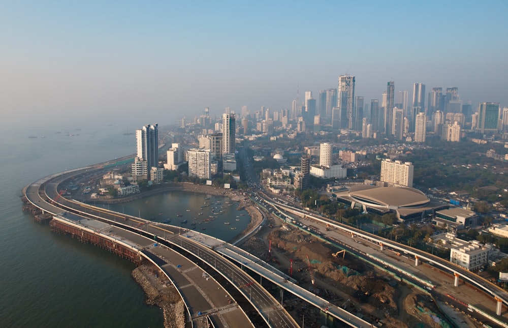 an aerial view of a city and a body of water