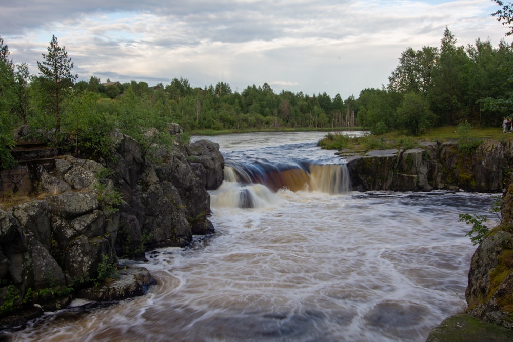 a river with a waterfall coming out of it