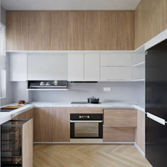 a kitchen with a stove top oven next to a refrigerator