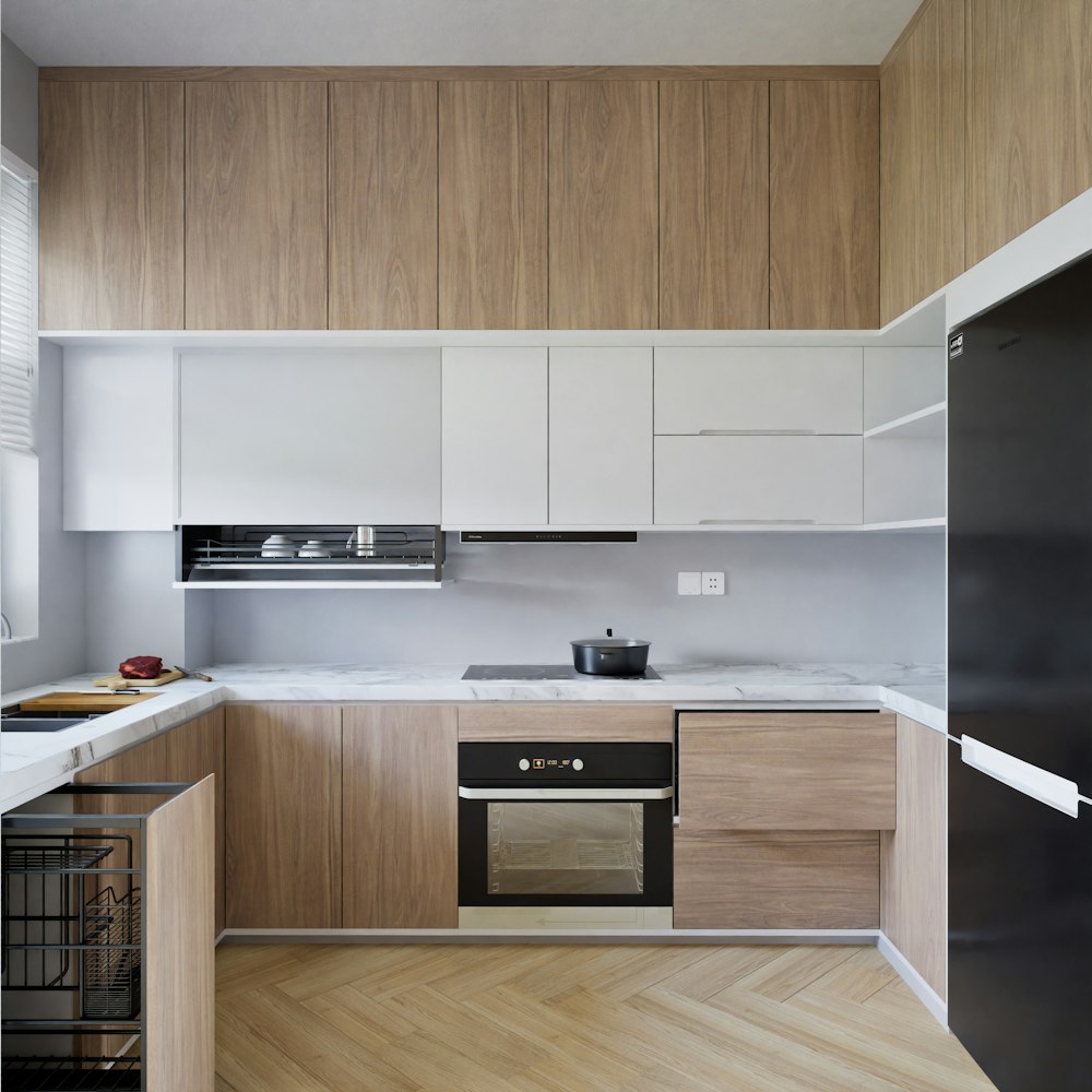 a kitchen with a stove top oven next to a refrigerator