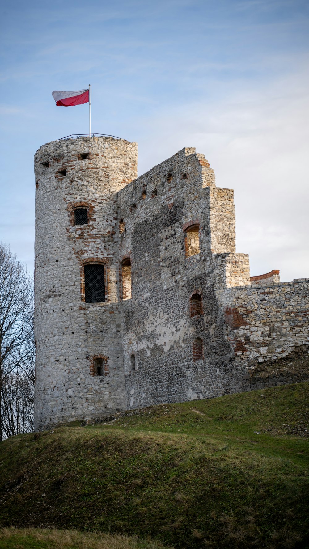 an old castle with a flag on top of it