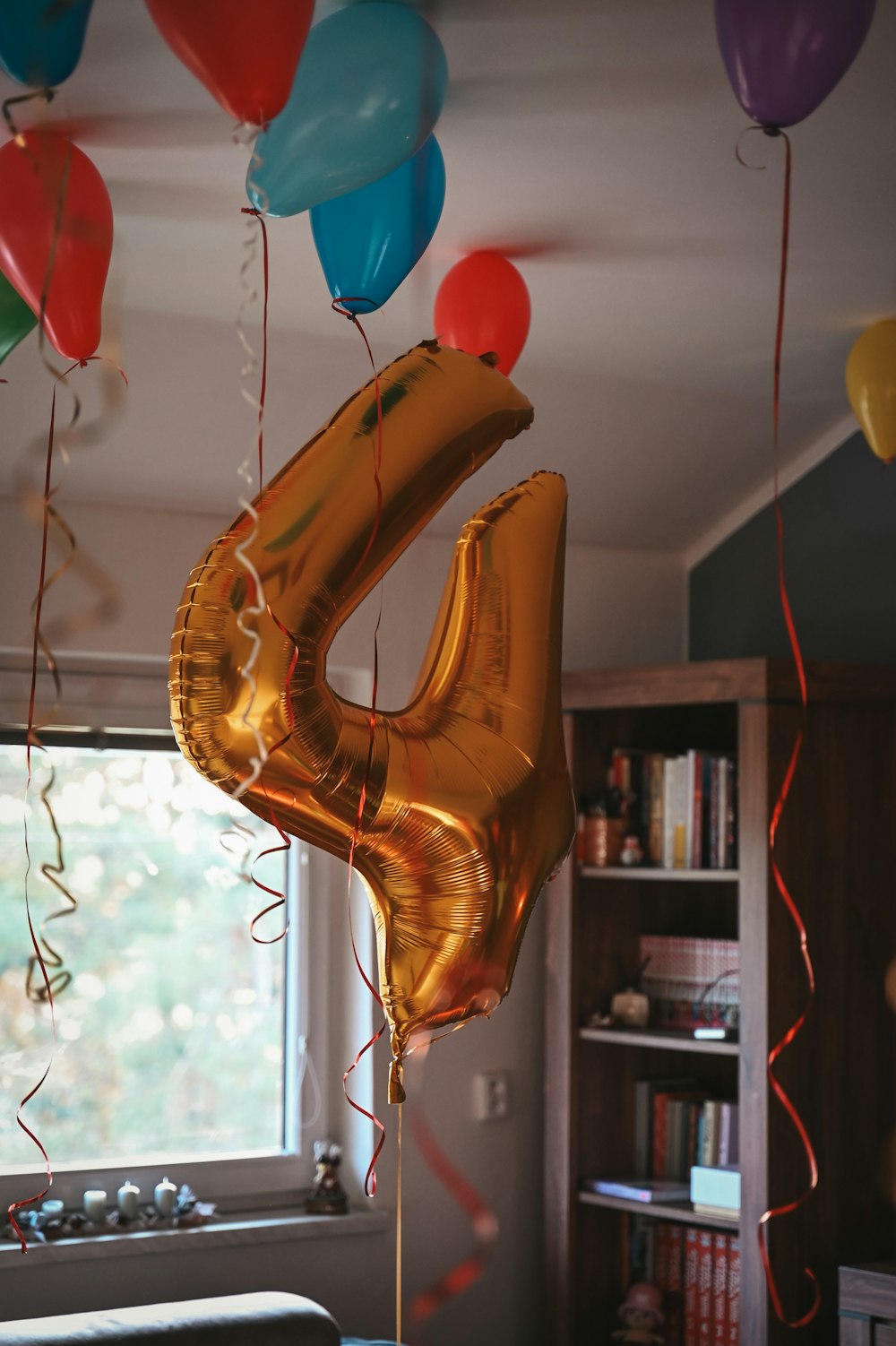 a bunch of balloons that are in the air