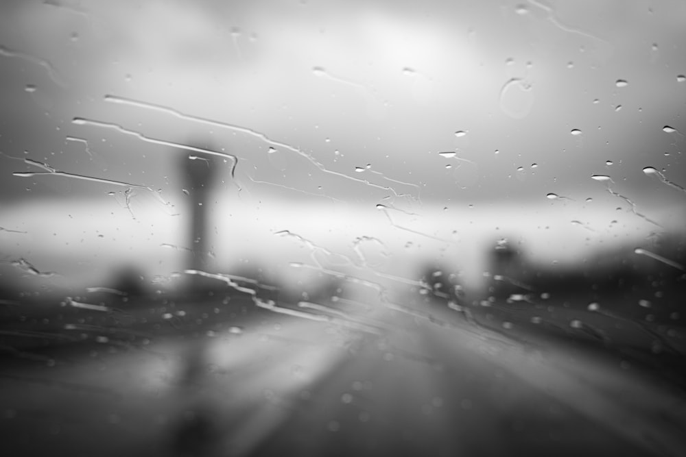 a black and white photo of rain on a windshield