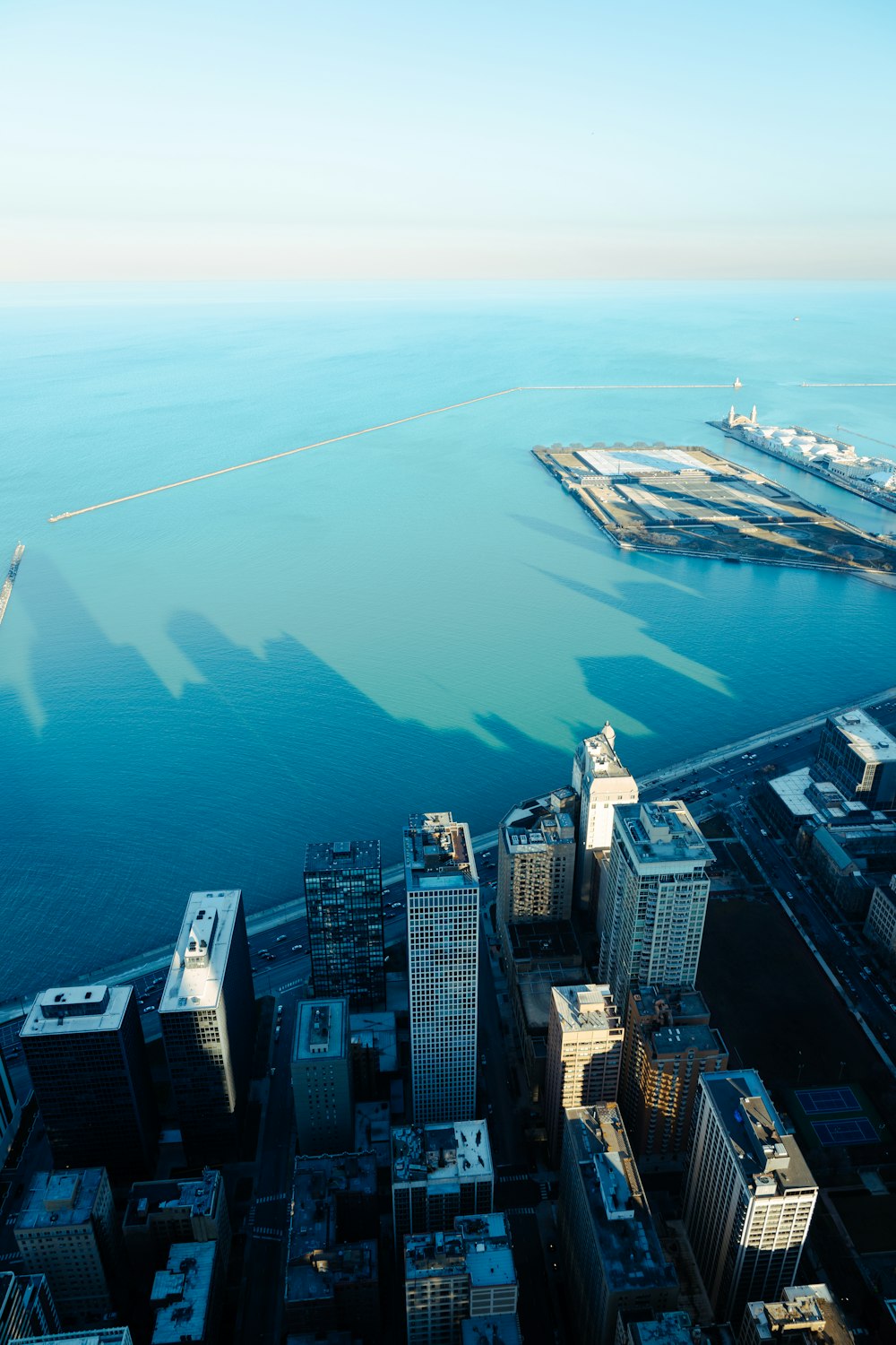 an aerial view of a city and a body of water