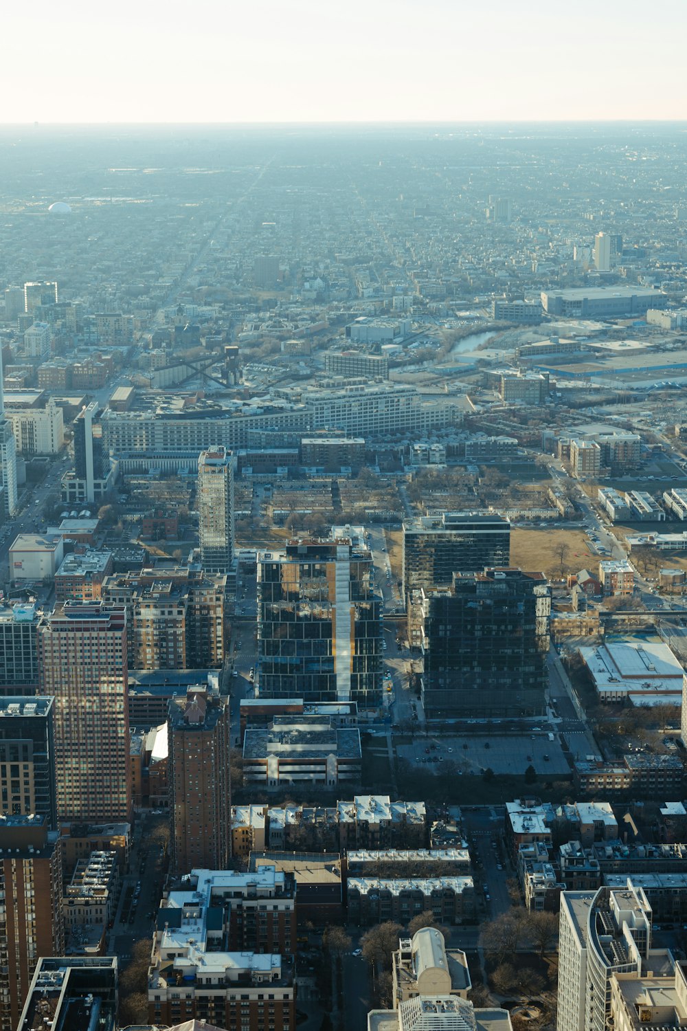 an aerial view of a city with tall buildings